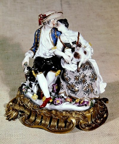 Meissen figures of a shepherd and shepherdess, mounted in Louis XV style ormolu scroll bases by German School